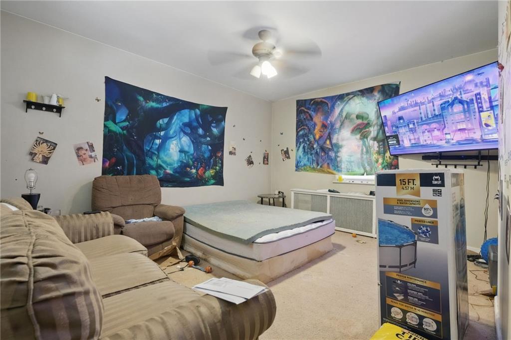 853 Railroad Street McKees Rocks, PA 15136 - Photo 10 of 19 a living room with furniture and wall paintings