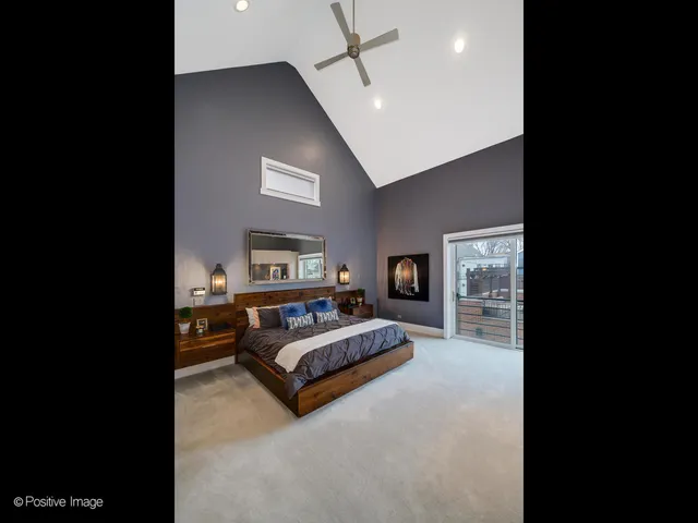 a living room with furniture and a ceiling fan
