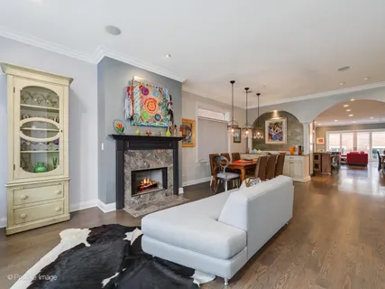 a living room with furniture fireplace and flat screen tv