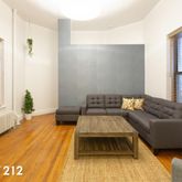 a living room with furniture and a rug