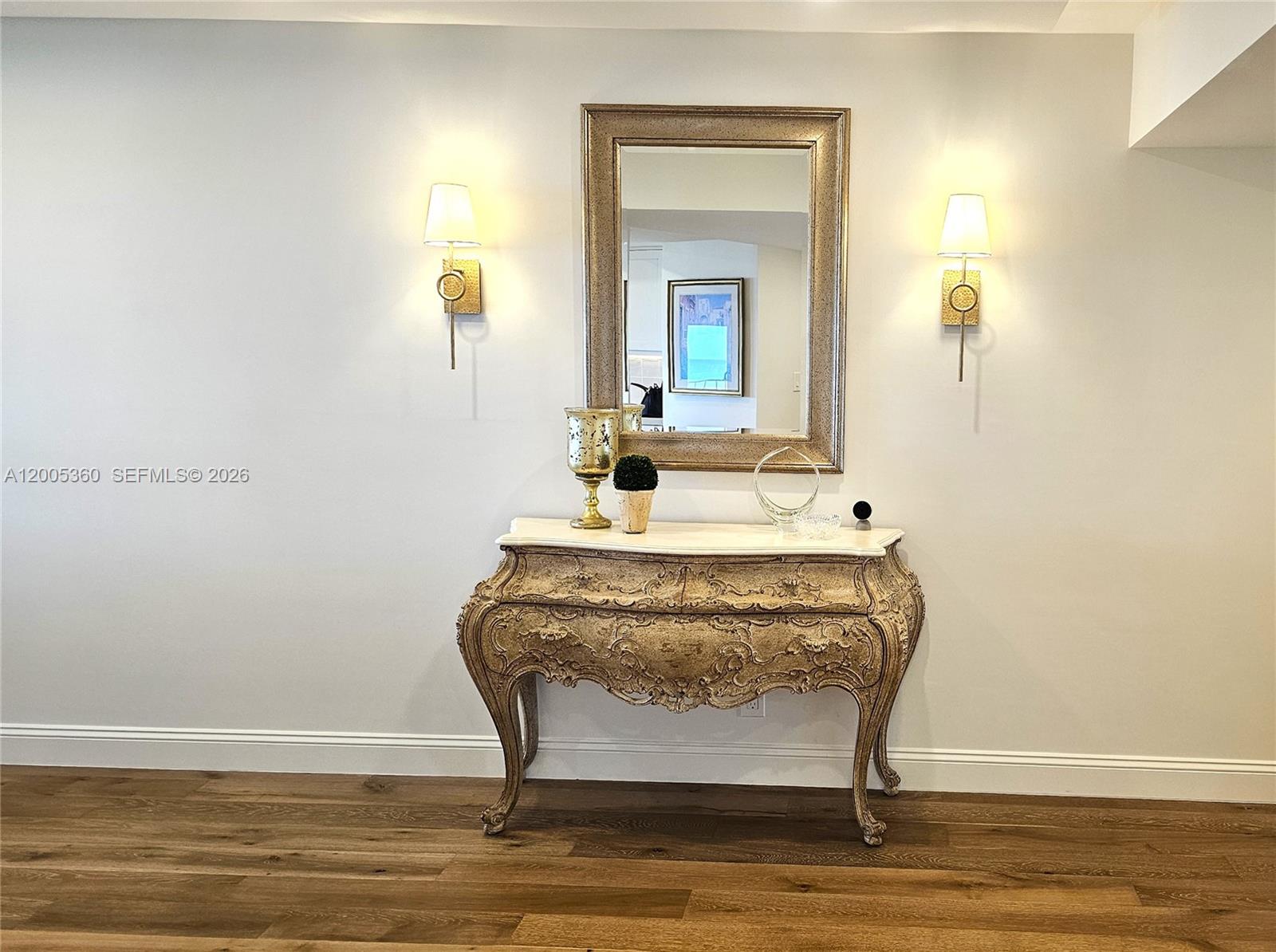 4001 North Ocean Boulevard, Unit 702 Boca Raton, FL 33431 - Photo 3 of 56 a room with a table and mirror