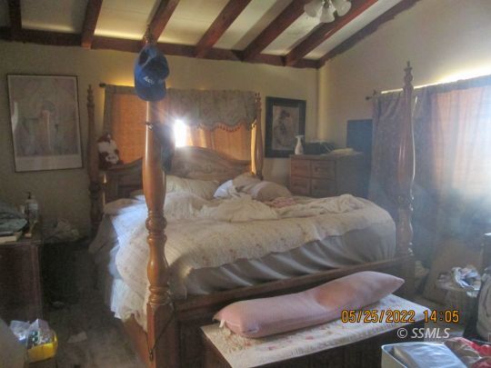 2021 South Inyo Street Ridgecrest, CA 93555 - Photo 4 of 7 a bedroom with a bed and a mirror