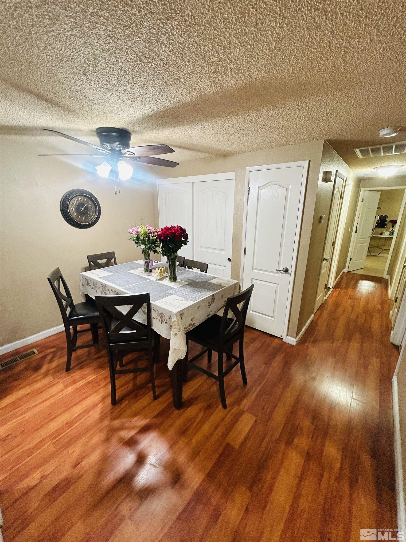 1342 Butler Street Reno, NV 89512 - Photo 3 of 16 a view of a dining room with furniture and wooden floor