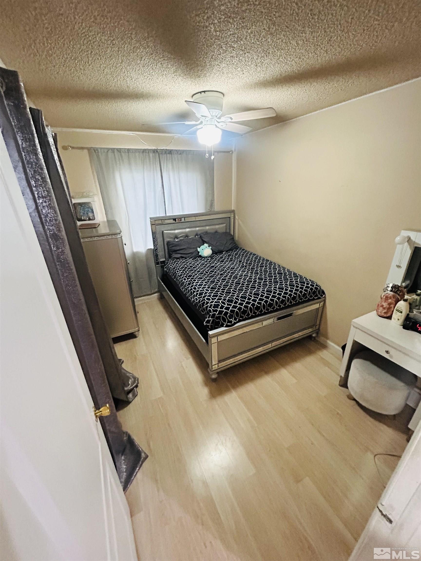 1342 Butler Street Reno, NV 89512 - Photo 10 of 16 a view of bedroom with furniture and staircase