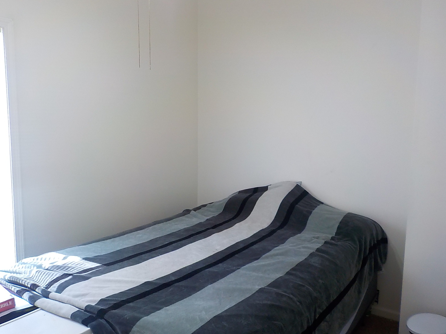 505 North 7th Street Rochelle, IL 61068 - Photo 5 of 9 a bed with white sheets and pillows on it