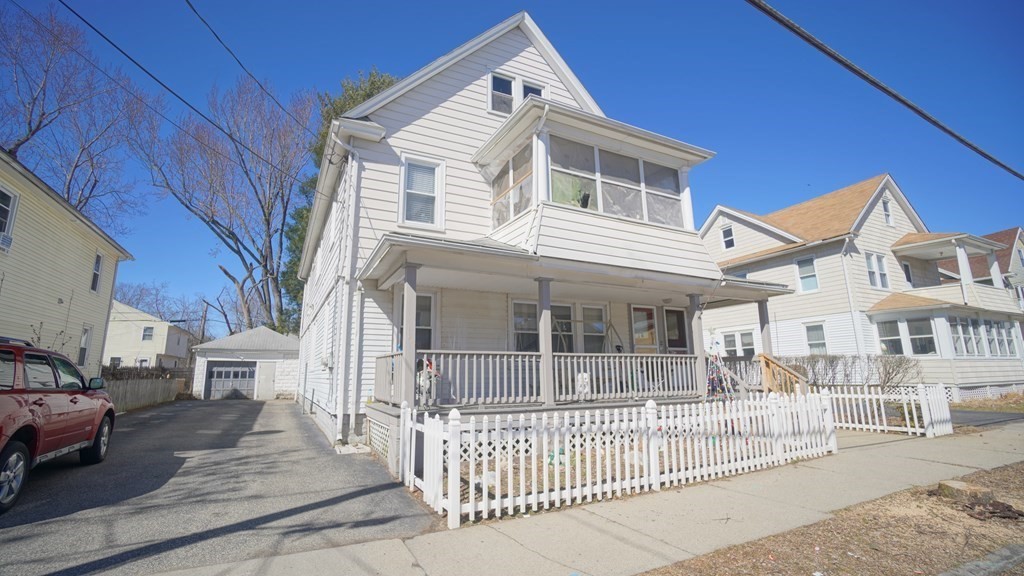 24-26 Wait Street Springfield, MA 01104 - Photo 5 of 15 a front view of a house with a garden
