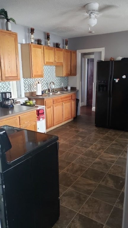 24-26 Wait Street Springfield, MA 01104 - Photo 6 of 15 a kitchen with granite countertop a refrigerator and a stove