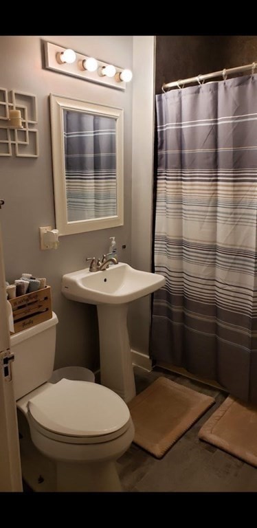 24-26 Wait Street Springfield, MA 01104 - Photo 9 of 15 a bathroom with a sink toilet and shower