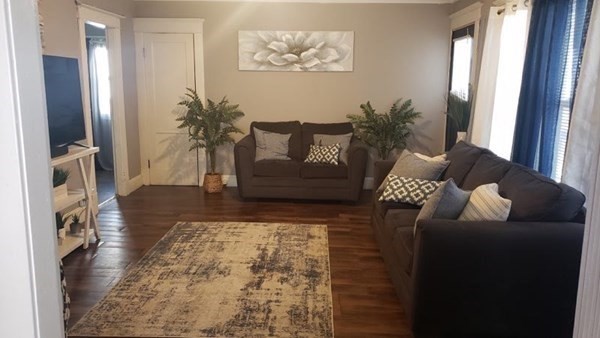 24-26 Wait Street Springfield, MA 01104 - Photo 10 of 15 a living room with furniture and a rug