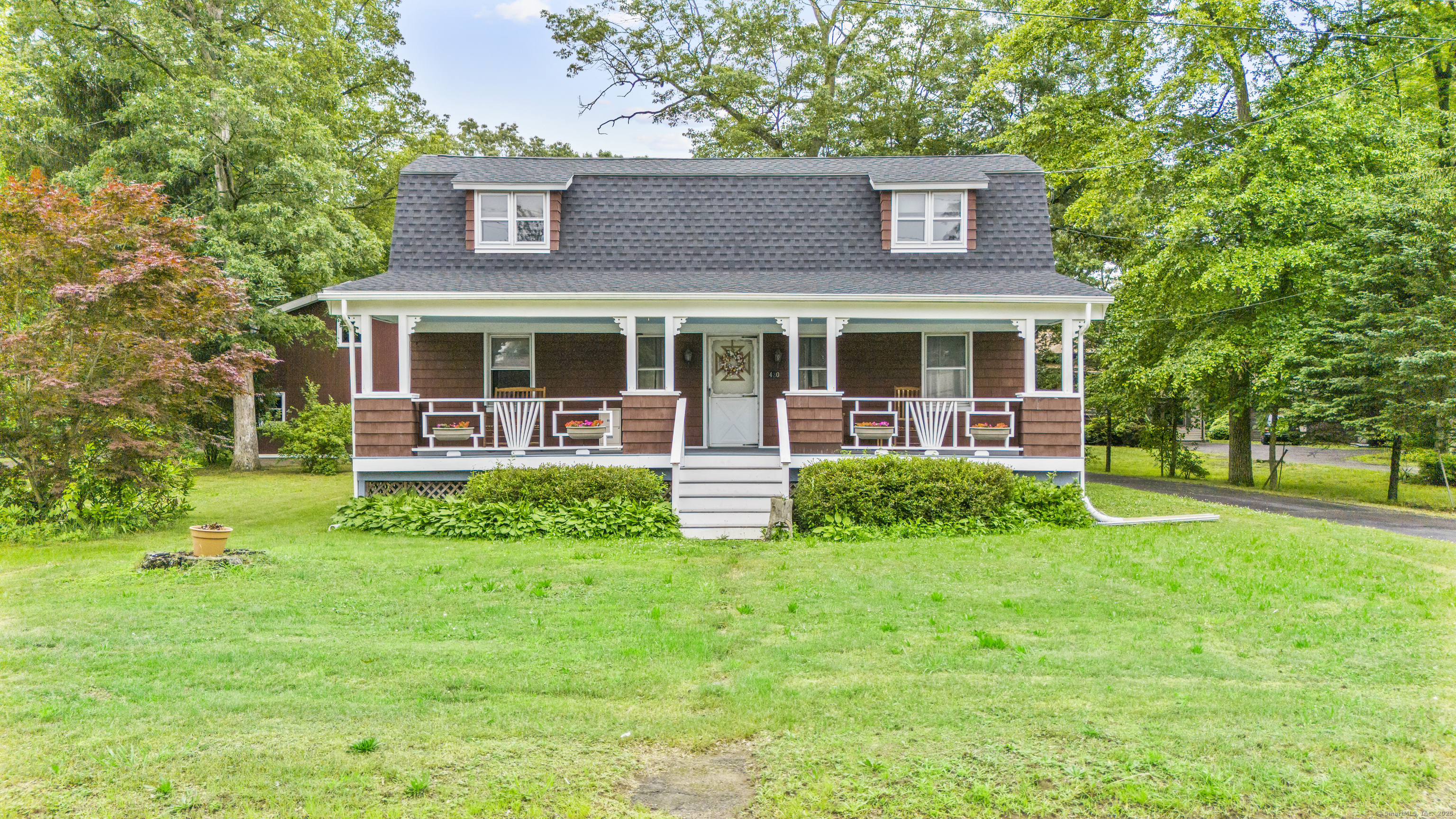 a view of a house with a yard and plants