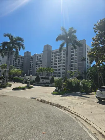 a view of a tall buildings next to a road