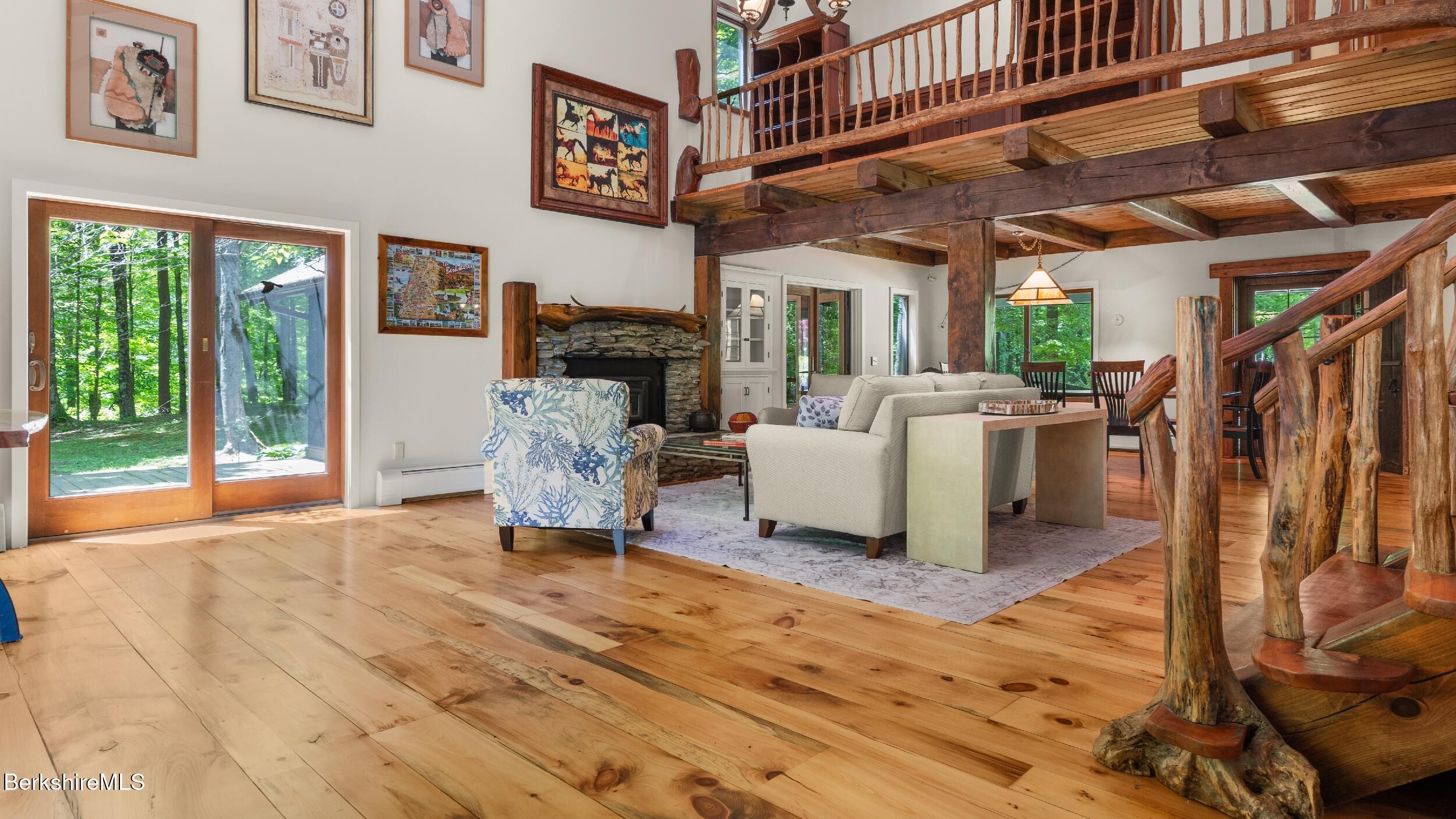 173 Hillsdale Road Egremont, MA 01230 - Photo 32 of 82 a living room with furniture a fireplace and a large window