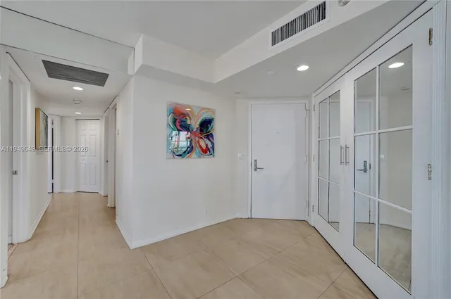 a view of a livingroom with furniture and a potted plant