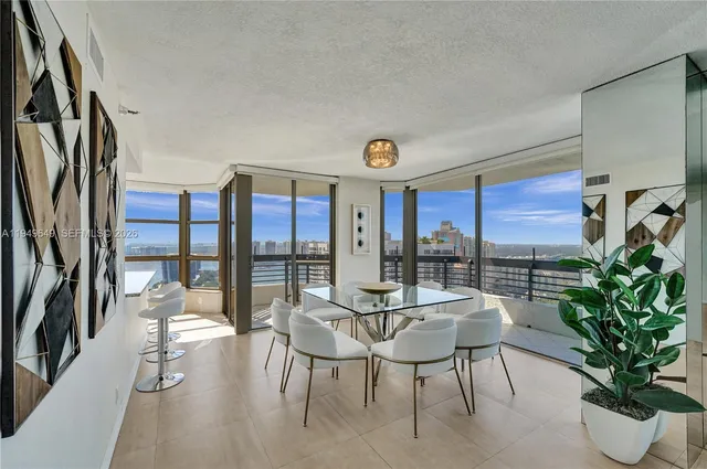 a kitchen with stainless steel appliances granite countertop a sink and a stove
