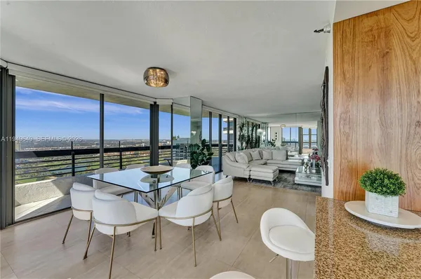 a bedroom with a large bed and a balcony view