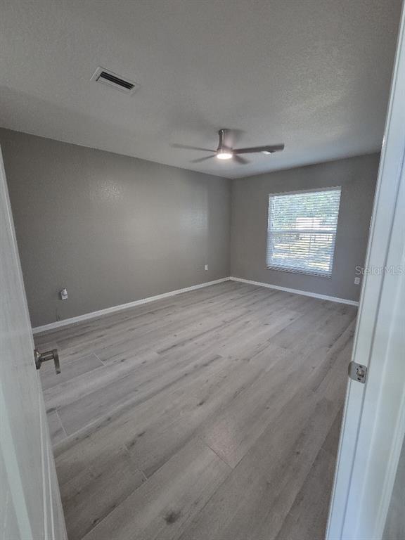 Undisclosed Address Spring Hill, FL 34609 - Photo 15 of 50 a view of an empty room with a window