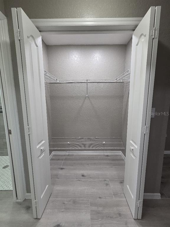 Undisclosed Address Spring Hill, FL 34609 - Photo 18 of 50 a view of closet