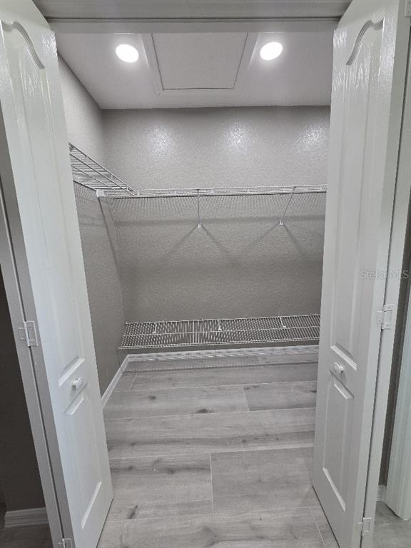 Undisclosed Address Spring Hill, FL 34609 - Photo 19 of 50 a view of walk in closet