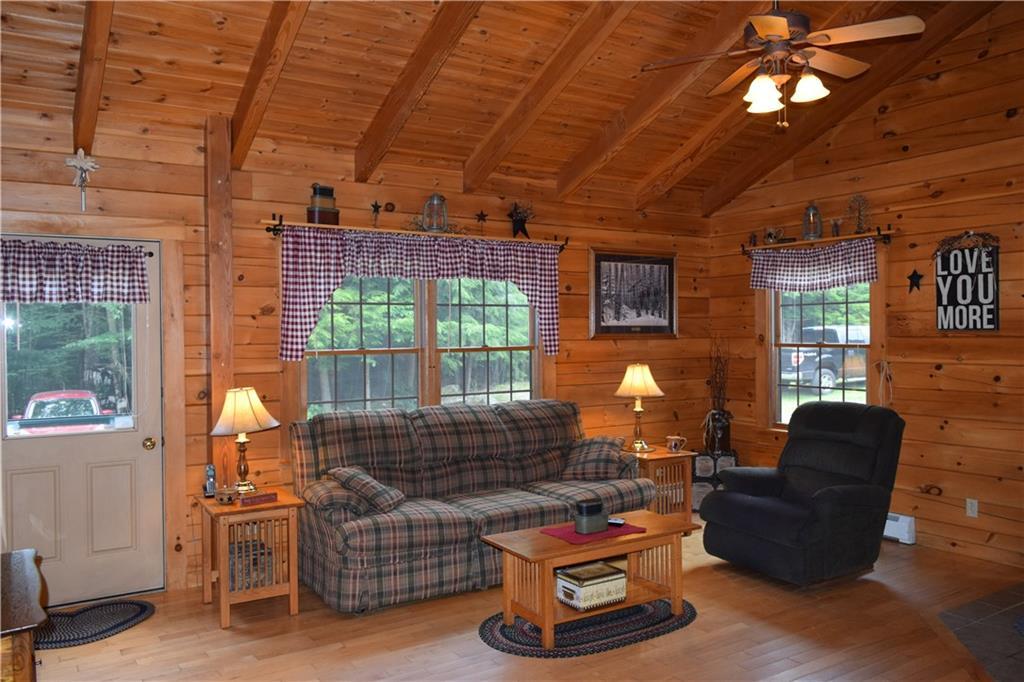 643 Dead River Road Bowdoin, ME 04287 - Photo 11 of 32 Open living room area with cathedral...
