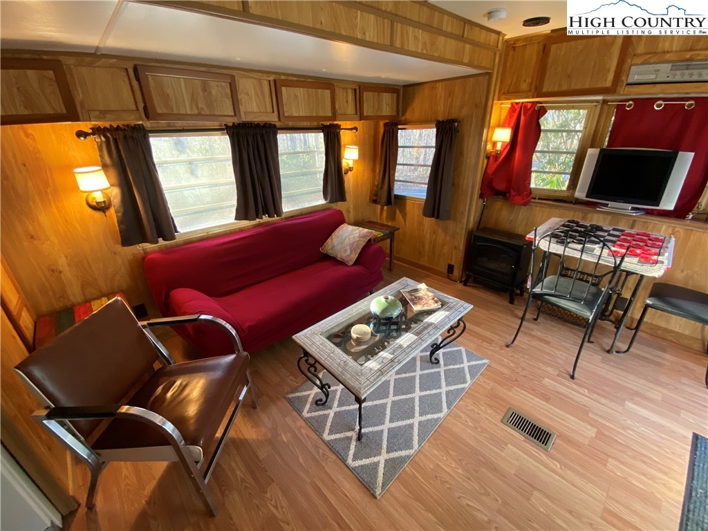 252 Jameson Road Newland, NC 28657 - Photo 13 of 16 a living room with furniture a rug and a flat screen tv