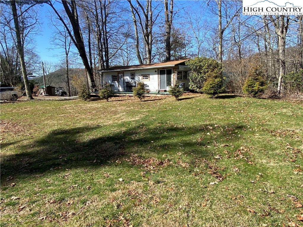 252 Jameson Road Newland, NC 28657 - Photo 2 of 16 a view of a yard with cars