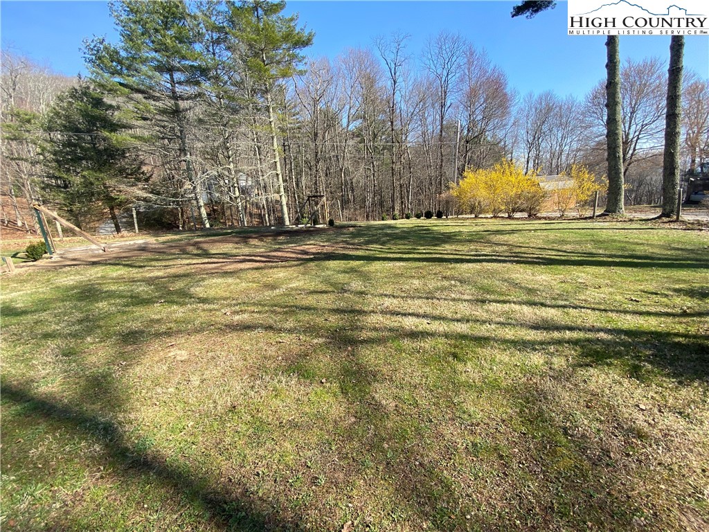 252 Jameson Road Newland, NC 28657 - Photo 5 of 16 a view of a yard with yellow house