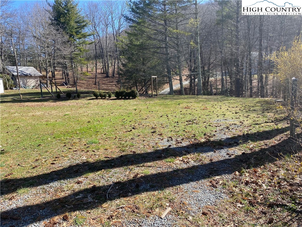 252 Jameson Road Newland, NC 28657 - Photo 6 of 16 a view of a yard with wooden fence