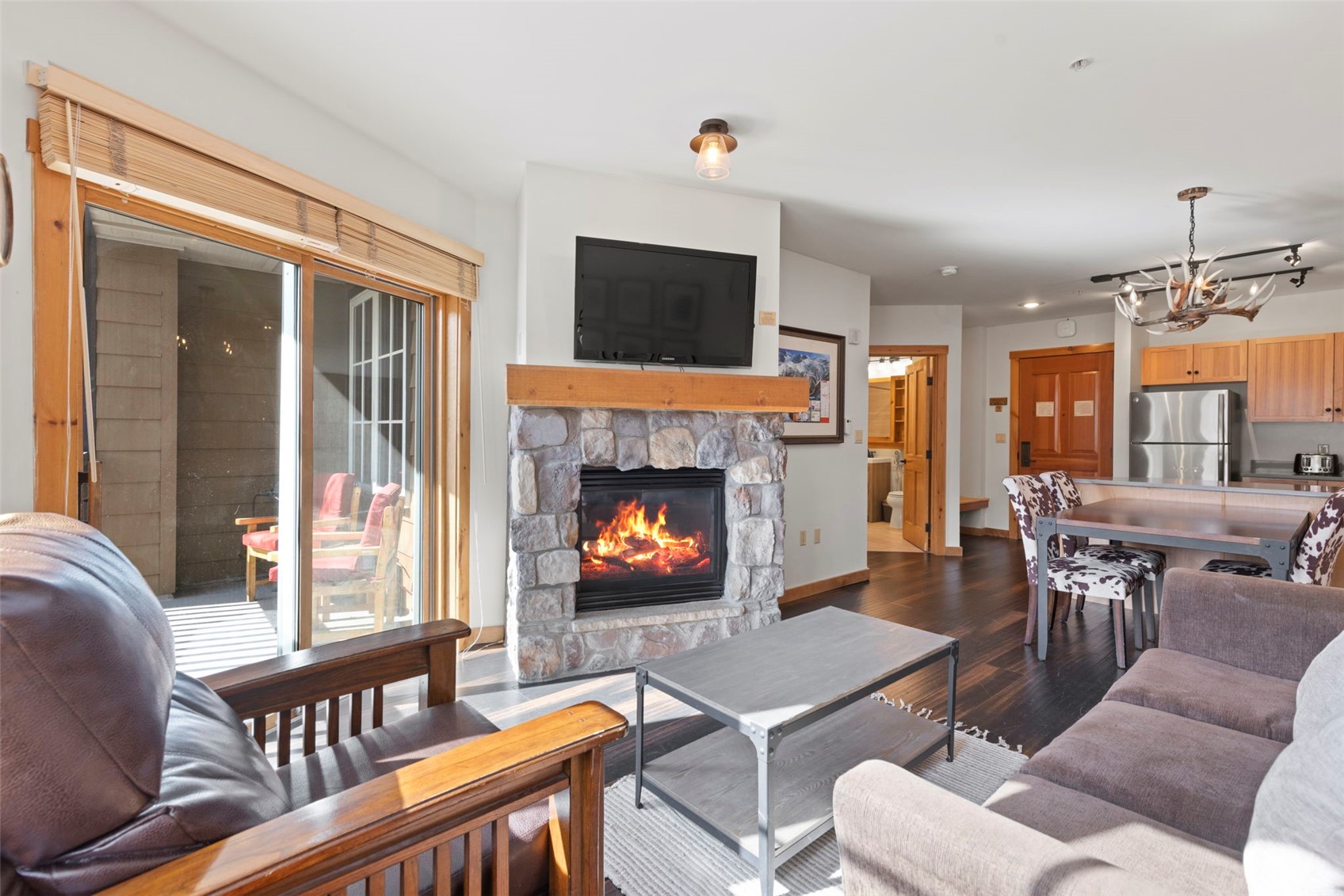 150 Dercum Square, Unit 8502 Keystone, CO 80435 - Photo 1 of 47 a living room with furniture a flat screen tv and a fireplace