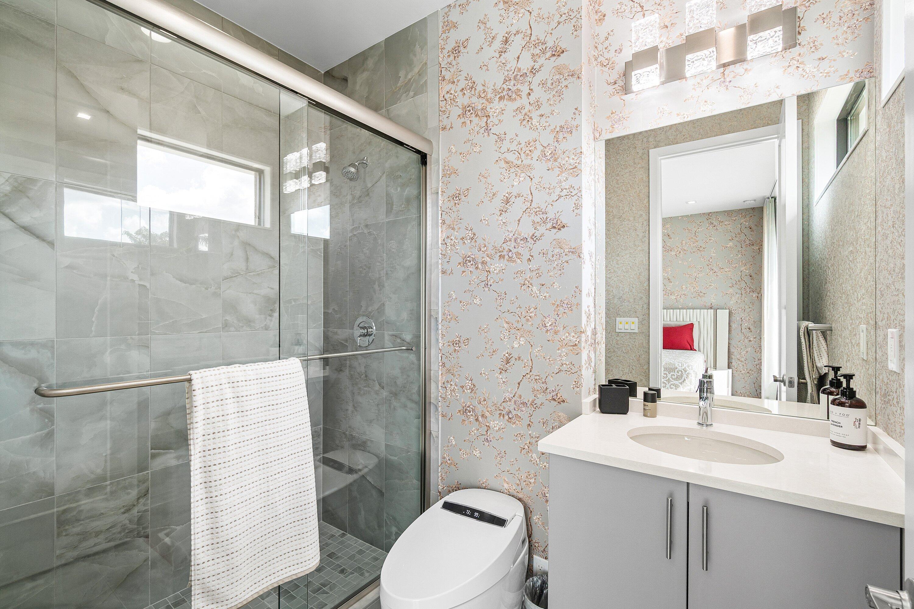 8233 Crystal Downs Avenue Boca Raton, FL 33434 - Photo 47 of 58 a bathroom with a sink vanity mirror and toilet