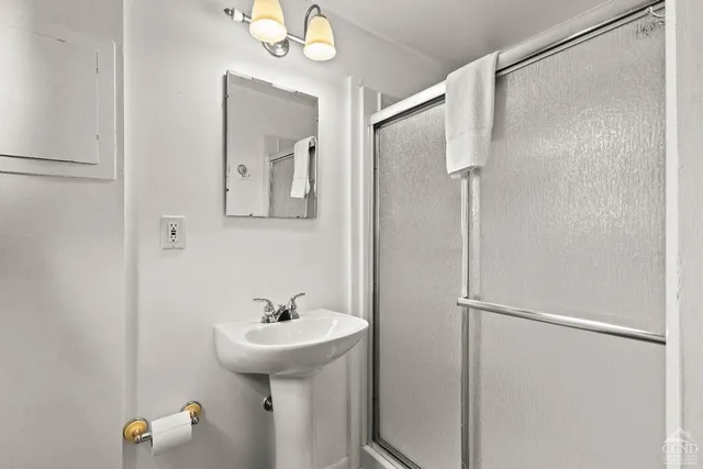 a bedroom with two beds and a table