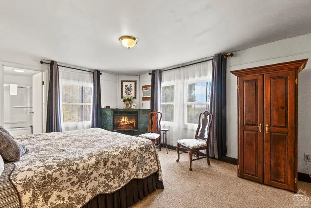 a bedroom with a bed and a table