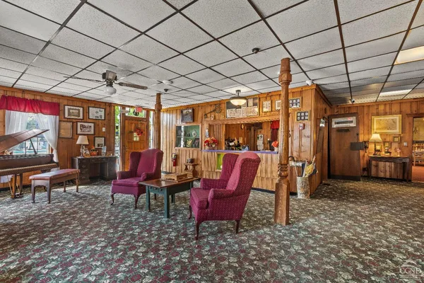 a view of a dining room with furniture window and outside view