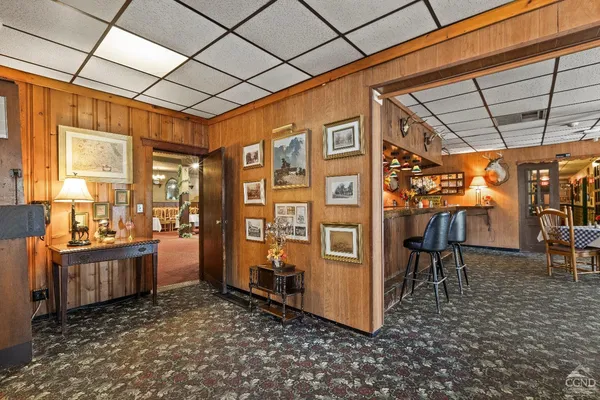 a swimming pool with outdoor seating and yard