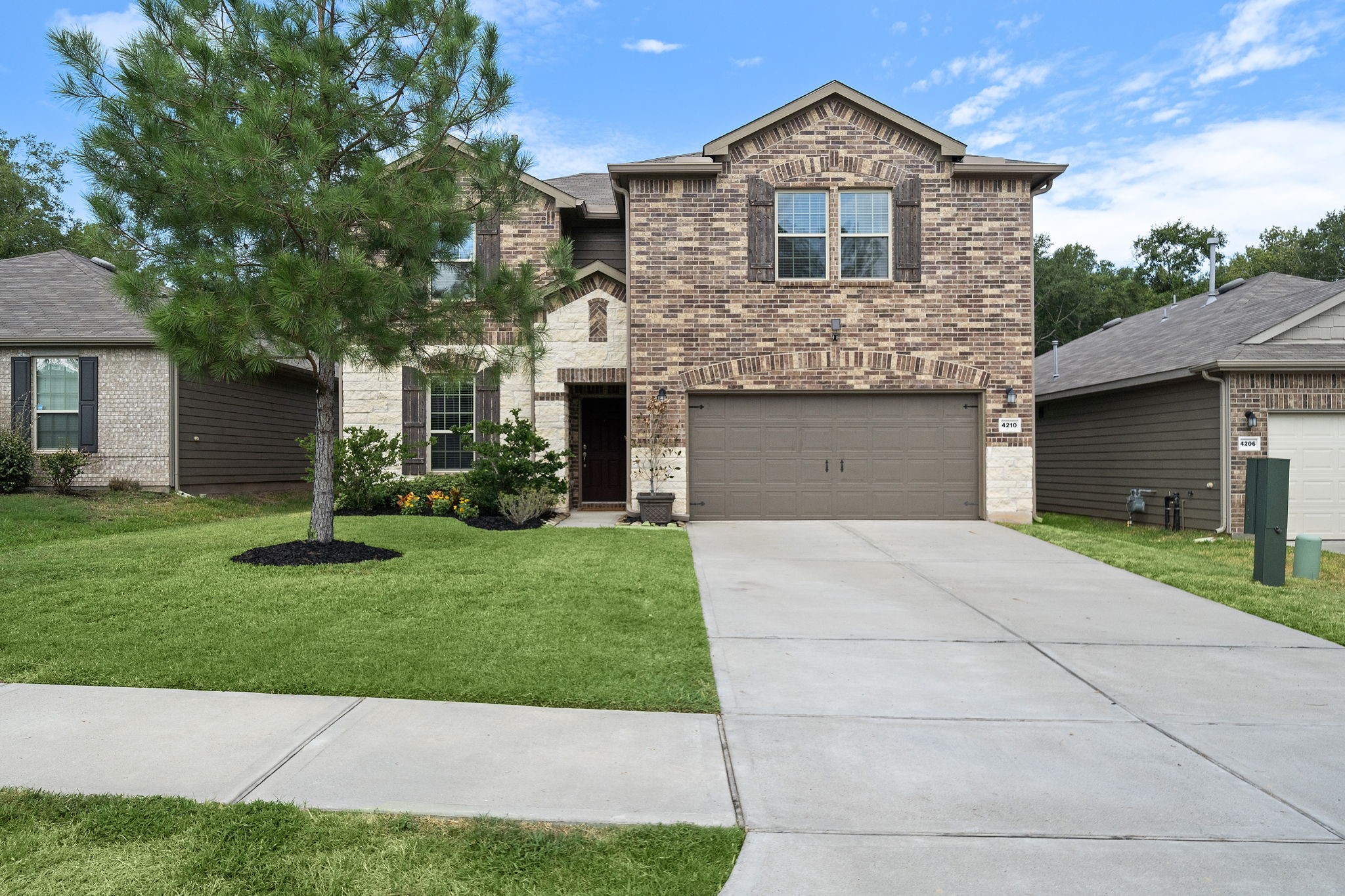 4210 Amber Ruse Drive Conroe, TX 77304 - Photo 1 of 45 Welcome to your new home—a charming brick facade nestled in a serene neighborhood, featuring a spacious driveway, and inviting entrance ready to welcome you.