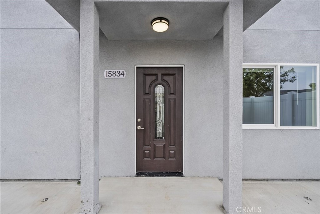a view of an entryway with wooden floor