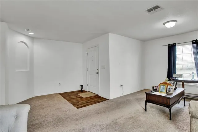 a kitchen with kitchen island granite countertop a sink cabinets and stainless steel appliances