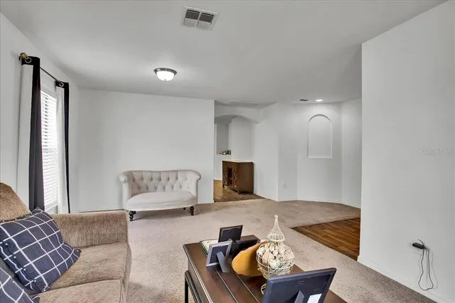 a kitchen with a refrigerator sink and wooden cabinets