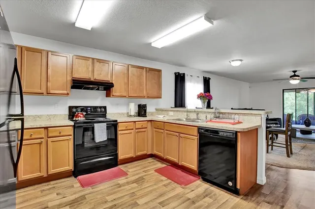 a view of a livingroom with furniture and window