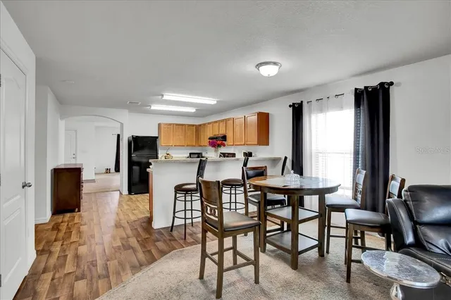 a view of a dining room with furniture window and outside view