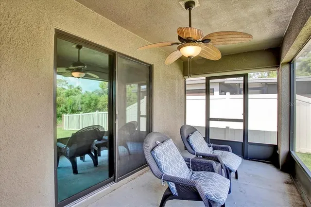 a view of a hallway with a livingroom and a hallway