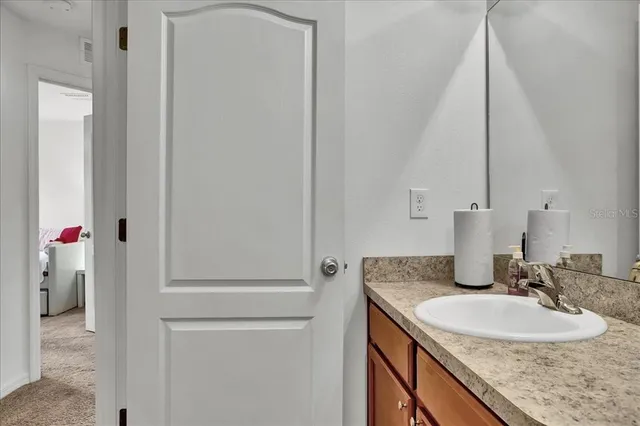 a white toilet sitting next to a white tub