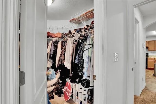 a view of a room with furniture and a window