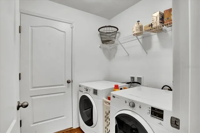 a living room with furniture and flat screen tv