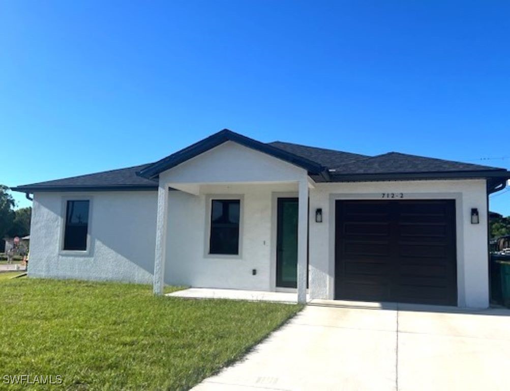 a backyard of a house with garage