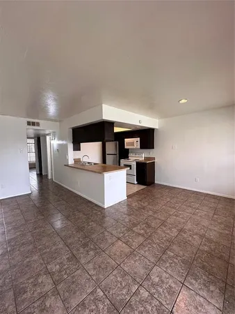 a view of a kitchen with a sink