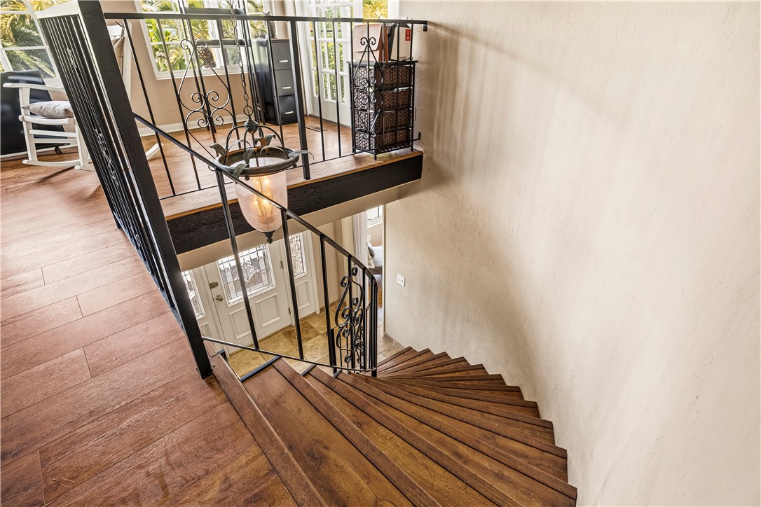 1485 Vía Ladera Fallbrook, CA 92028 - Photo 11 of 43 a view of staircase with wooden floor and white walls