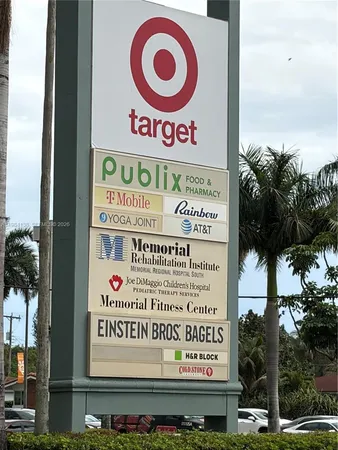 a view of a park with large trees