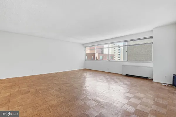 a view of an empty room with a window