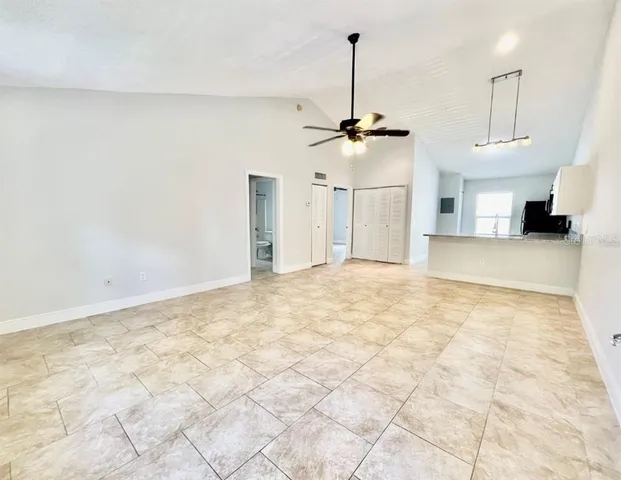 a bathroom with a granite countertop sink a mirror and vanity