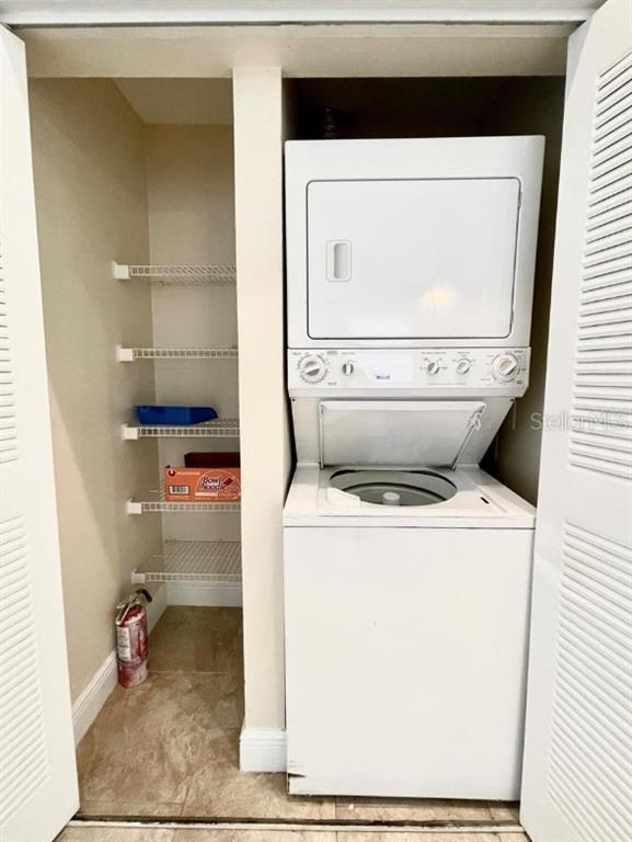 3651 North Goldenrod Road, Unit D201 Winter Park, FL 32792 - Photo 7 of 12 a utility room with dryer and washer
